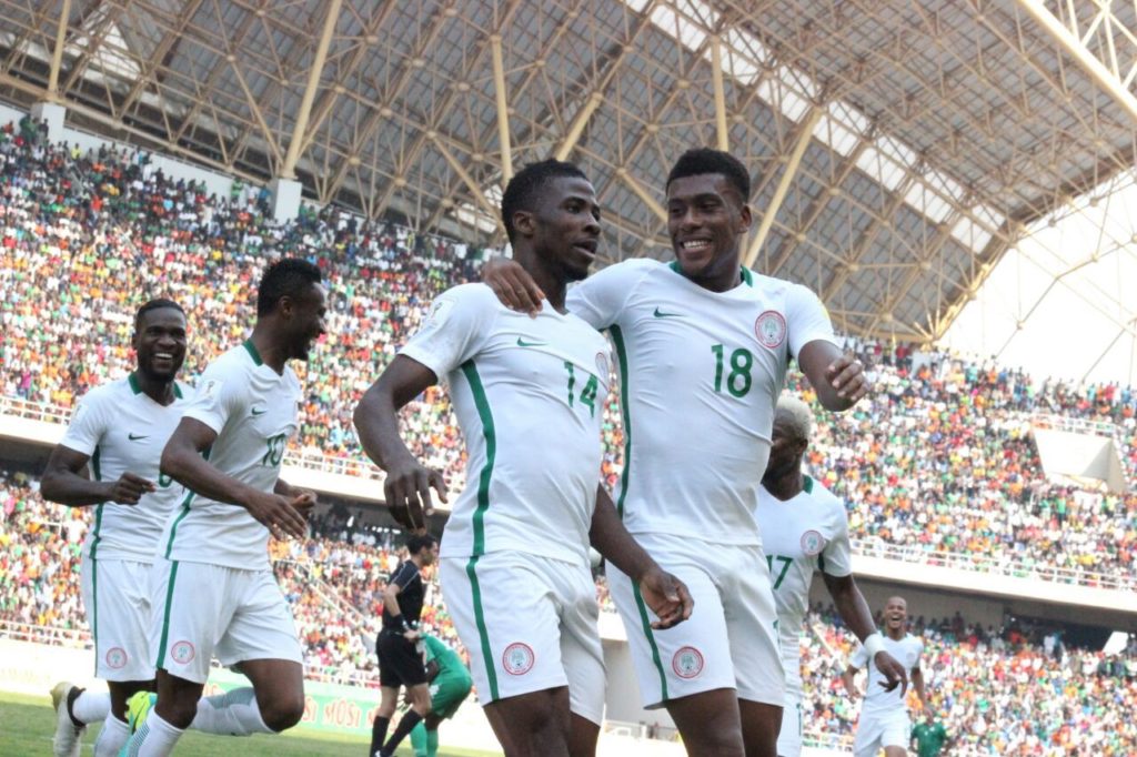 Super Eagles players, Kelechi Ihenacho of Man City and Alex Iwobi celebrate a goal